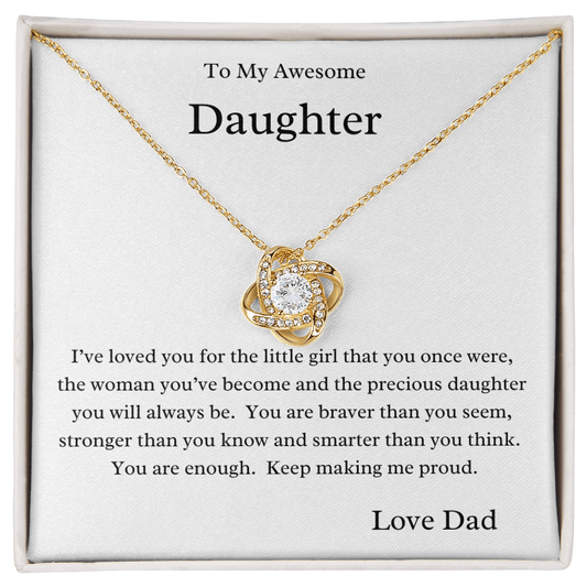 A necklace with a cubic zirconia pendant, presented in a box with a message to an daughter, expressing love and pride from dad.